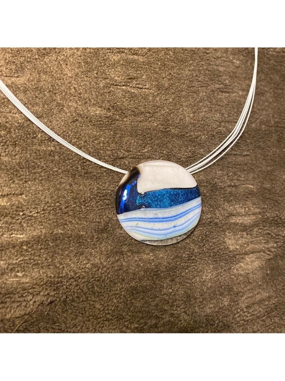 Locally crafted glass art. Glass on necklace.